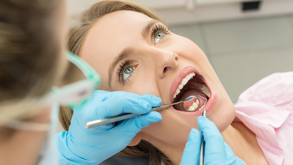 Lady in dentist chair exam